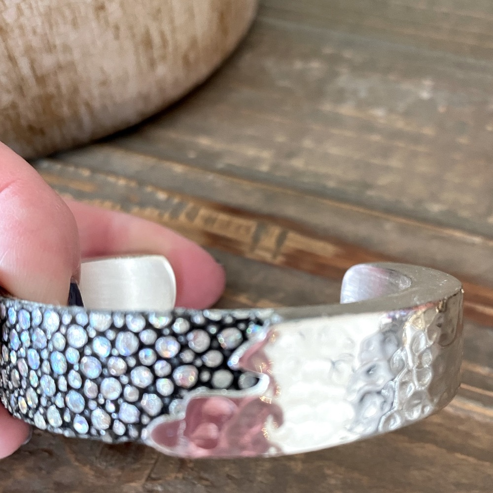 Rustic cuff metal bracket with pebbled details and hammered details